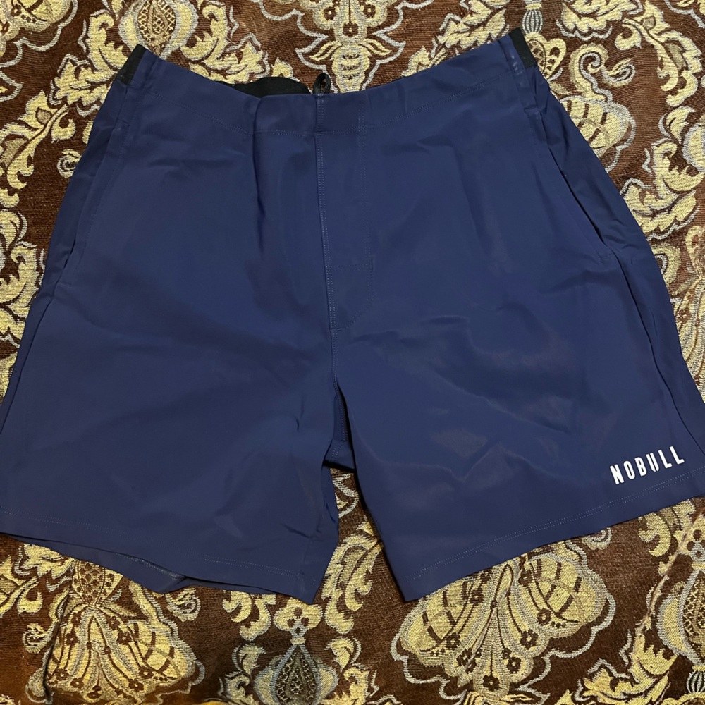 New w/out tags. Navy Blue XL 7 in inseam.